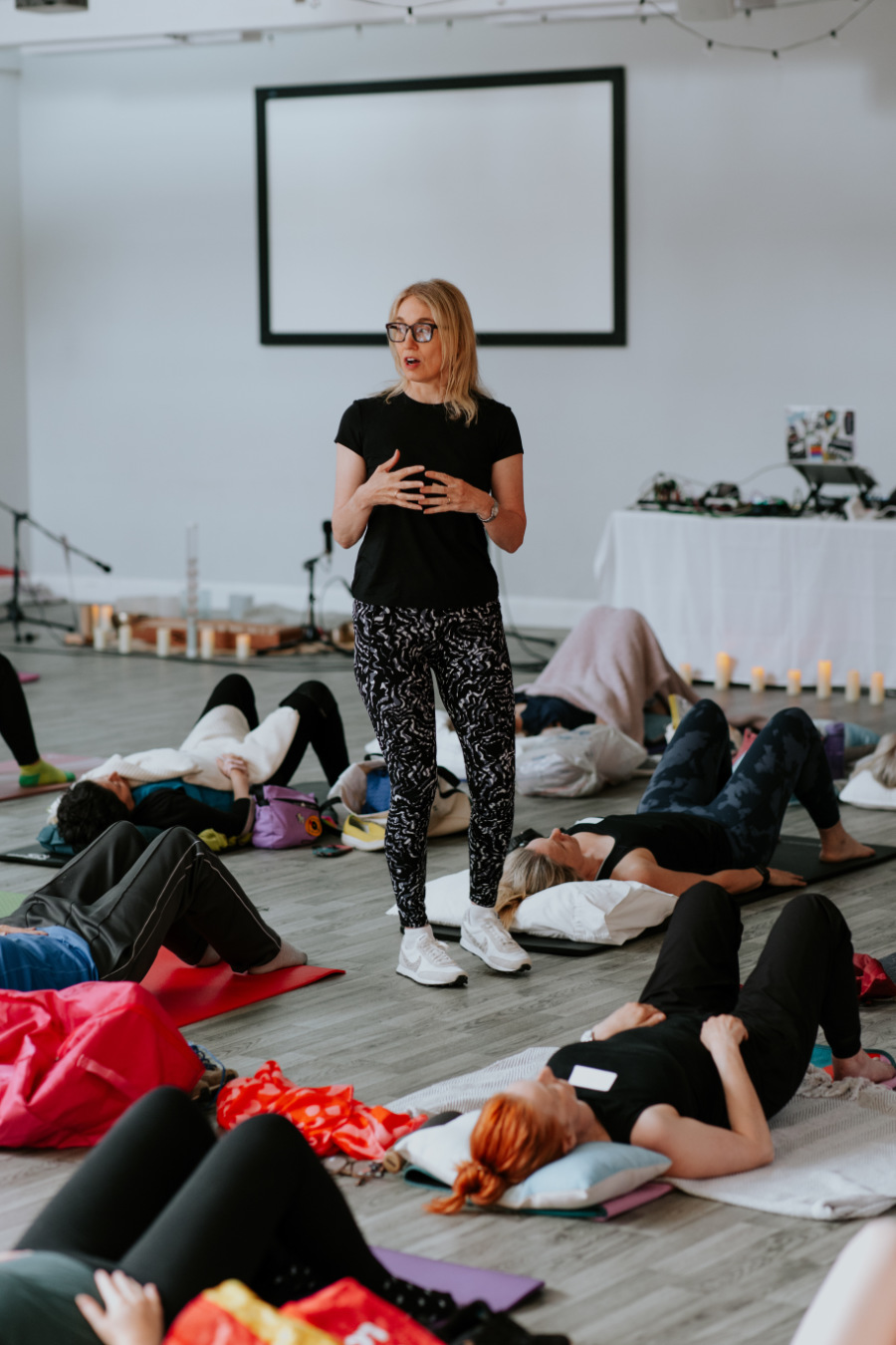 Jeannie Di Bon guiding a clinician through a movement assessment on a Pilates reformer
