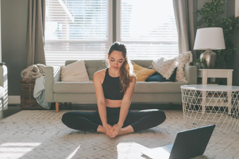 A Zebra Club member doing gentle floor-based movement at home